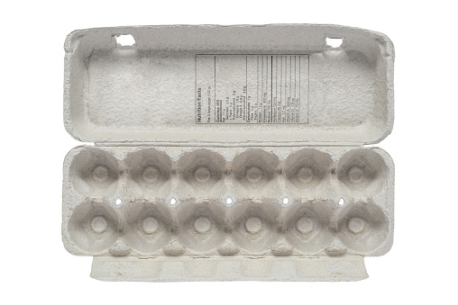 Top view of empty egg carton with lid and nutrition facts table, isolated on white background.