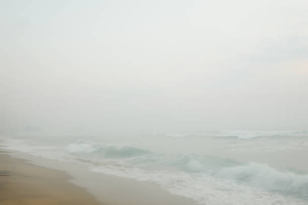 istock sea surf with fog 1408154874
