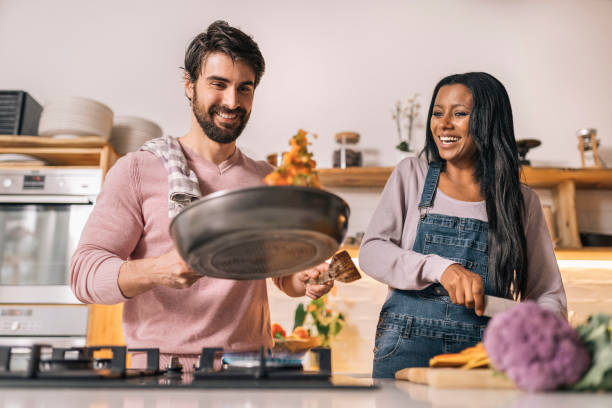 istock Happy Couple Cooking at Home 1408158148