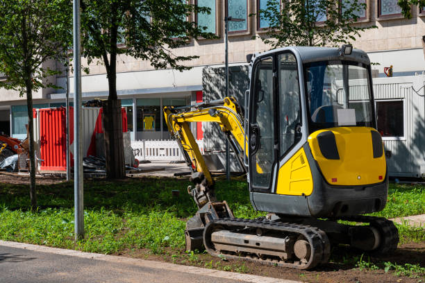 istock A small yellow excavator at a construction site in the city. 1408161180