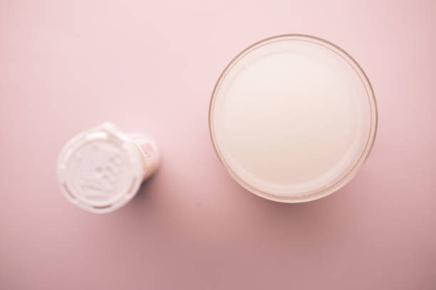 istock Effervescent soluble tablet pills and glass of water on table 1408163795