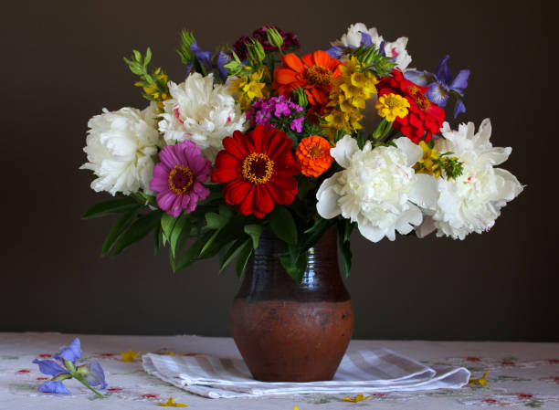 istock garden flowers in a clay jug. 1408163889