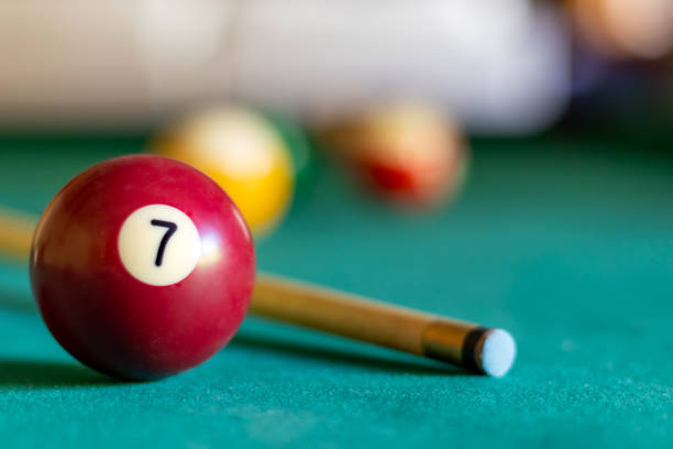 istock Billiard seven ball on green tapestry 1408165033