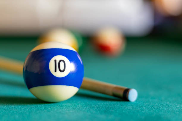 Billiard teen ball on green tapestry Billiard teen ball on green tapestry and more balls in the backgrownd pool break stock pictures, royalty-free photos & images