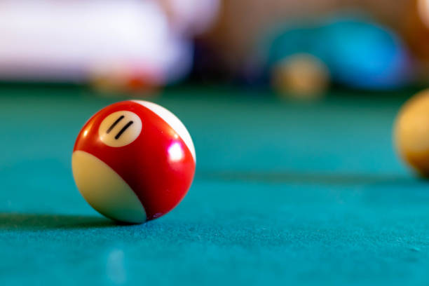 istock Billiard eleven ball on green tapestry 1408165061
