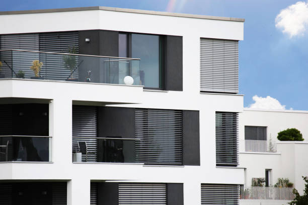 istock New apartment building with white facade paint and dark blinds 1408165777