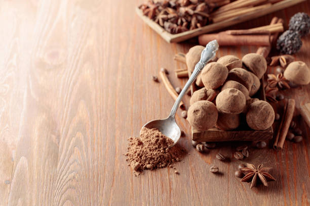 istock Chocolate truffles on a wooden table. 1408168775