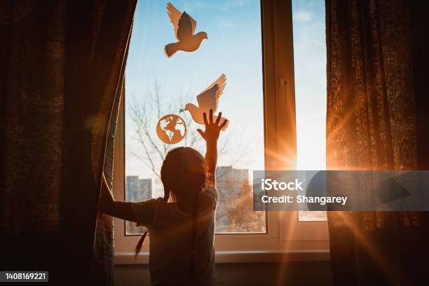 Child Stretches His Hands Sunlight Outside Window Flying Dove World With Branch Forces Globe Concept Peace World No War Ecology Stock Photo - Download Image Now
