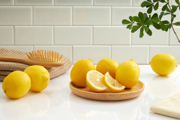istock Front view lemon decorated with cosmetic jar towel sink in ceramic tile background 1408173715