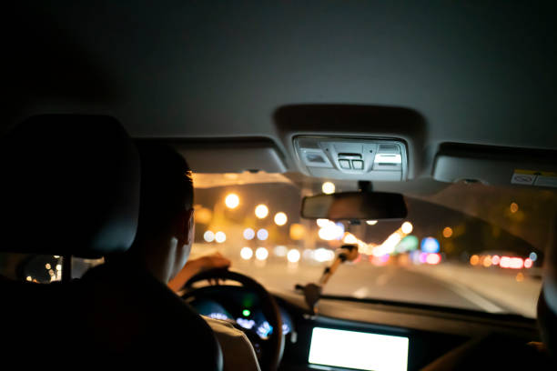 istock man driving car happily 1408175975