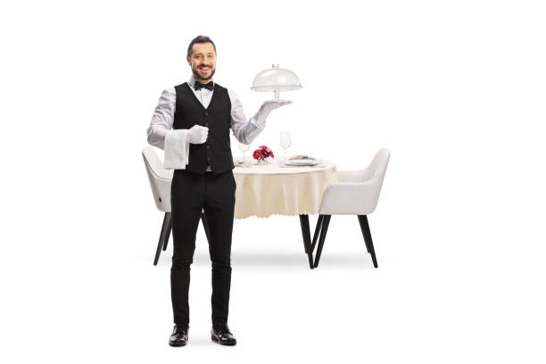 istock Waiter holding an empty cake plate in front of a table 1408177464