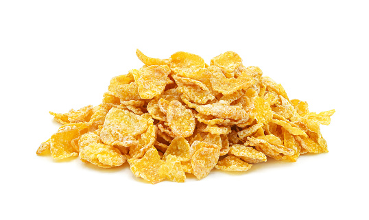 Heap of cornflakes isolated on white background.