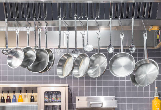 istock Industrial Kitchen , pots and tools on shelves. 1408182151