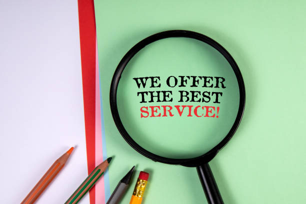 istock We offer the best service. Magnifying glass and text on a green background 1408184840