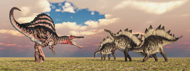 istock The dinosaurs Spinosaurus and Stegosaurus in a landscape 1408186942