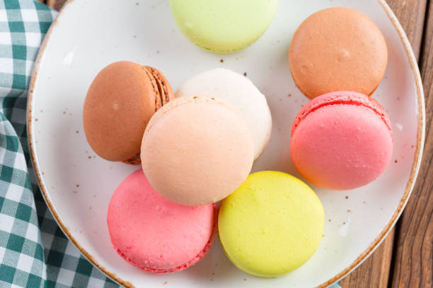 istock Colorful macaroon cookies on white plate close up 1408190767