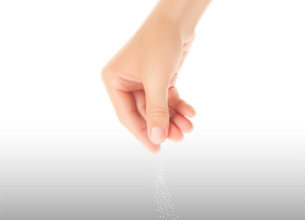 istock The hand from top to bottom which salts with a pinch of salt. 1408191299