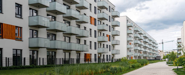 Modern residential complex of apartment buildings with glass balconies on housing estate stock photo