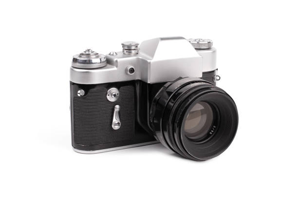 istock Old SLR camera isolated on white background. 1408195244