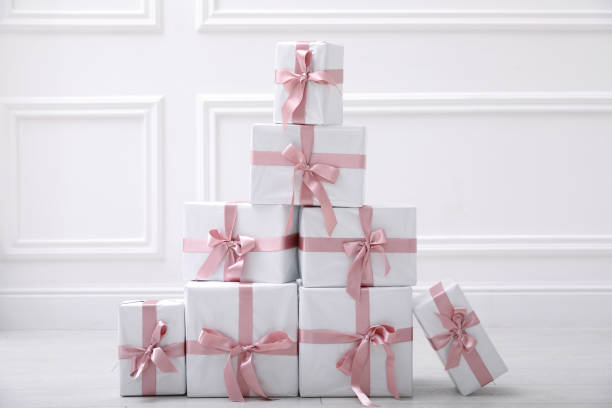 istock Many gift boxes on floor near white wall in room 1408195360