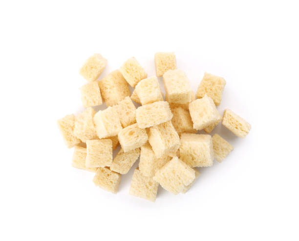 istock Heap of crispy croutons on white background, top view 1408195873