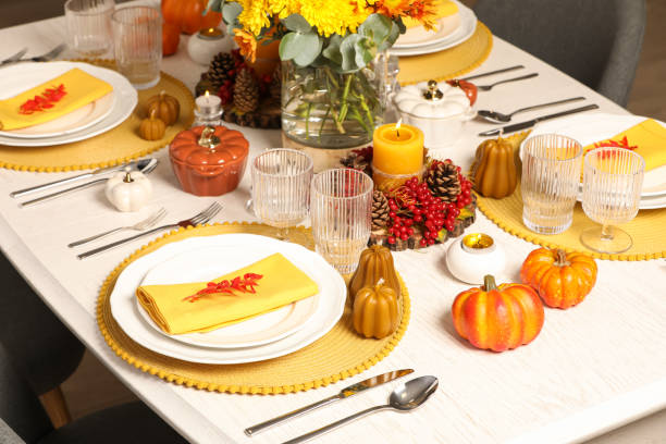 istock Autumn table setting with floral decor and pumpkins indoors 1408197150