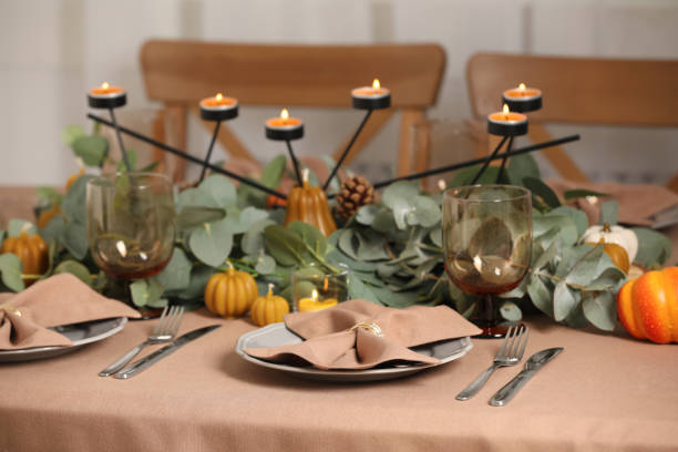 istock Autumn table setting with eucalyptus branches and pumpkins indoors 1408197707