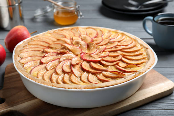 istock Tasty apple pie on grey wooden table 1408199019