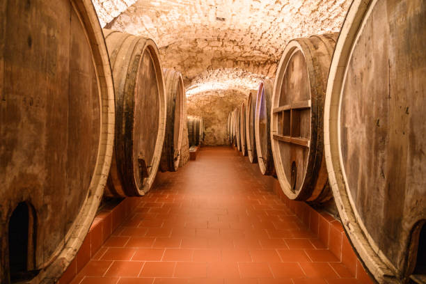 istock Vintage winery cellar with wine wooden barrels 1408199209