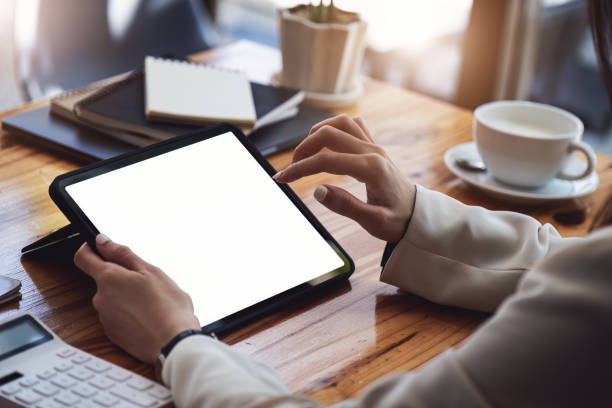 istock business woman of financial consultant using digital tablet touchpad computer. tablet blank screen mockup 1408200316