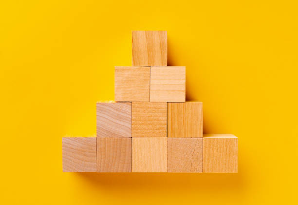 istock Top view of wooden cubes on yellow 1408202105
