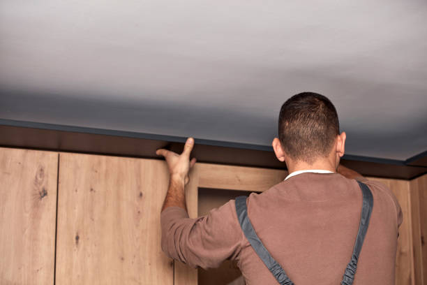 istock Handyman making kitchen wall cabinets in the apartment. 1408202150