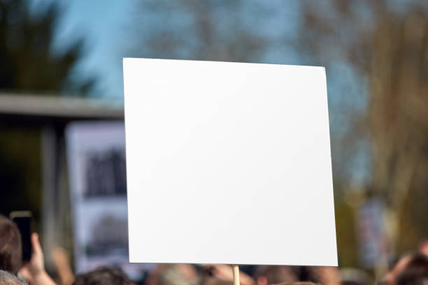 istock Protesters holding placards and signs on the streets. 1408202884