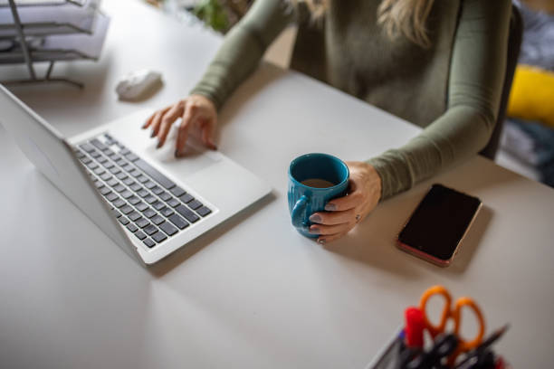 istock Unrecognizable Caucasian woman working on laptop, from modern home office 1408208598