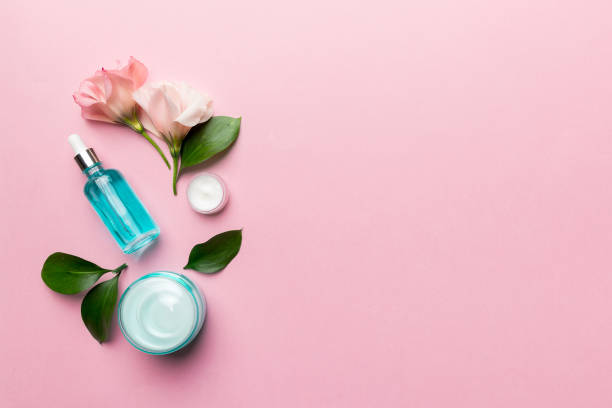 istock Composition with cosmetic products and beautiful roses on color background. Copy space, flat lay 1408209901