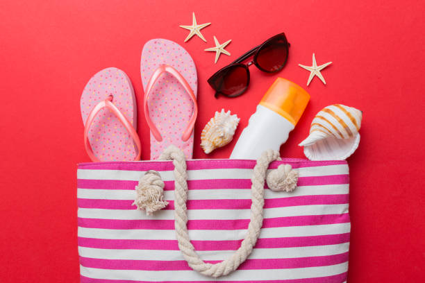 istock beach accessories flat lay top view on colored background Summer travel concept. Bag with starfish and sea shell. Top view 1408210837