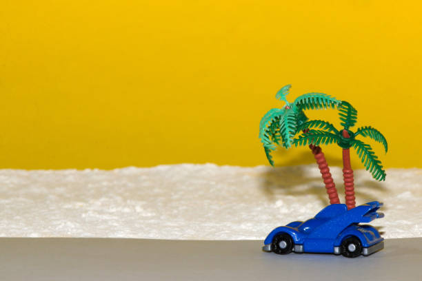 istock blue car passing by a palm tree on the beach, modern design, minimal concept, travel 1408213859