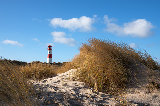 Panoramic image of List East lighthouse against blue sky, Sylt, North Frisia, Germany