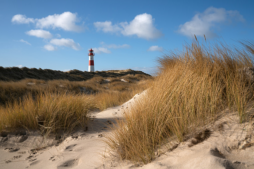 Panoramic image of List East lighthouse against blue sky, Sylt, North Frisia, Germany