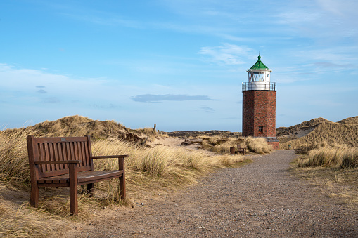 Panoramic image of Kampen lighthouse against evening sky, Sylt, North Frisia, Germany