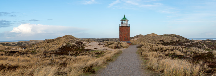 Panoramic image of Kampen lighthouse against blue sky, Sylt, North Frisia, Germany