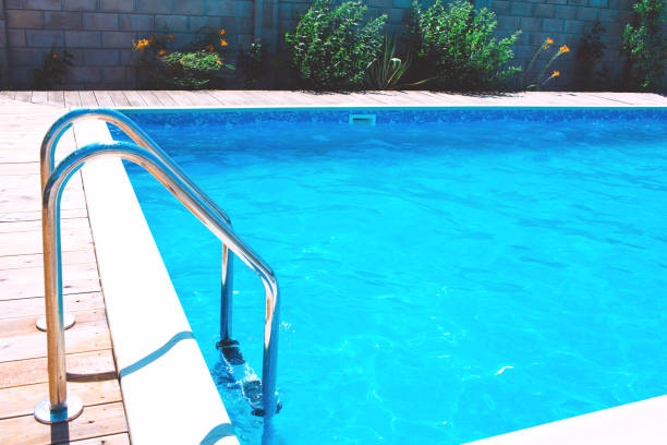 istock Swimming pool with stair at hotel. 1408217445