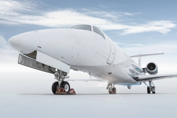 istock Close-up of a modern private jet isolated on bright background with sky 1408217485