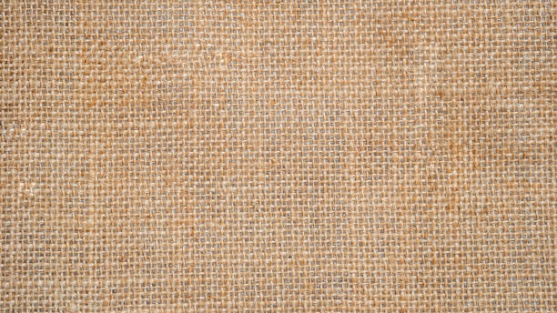 istock Burlap sackcloth background and texture, brown natural Burlap Fabric, with space for text decoration. 1408221536