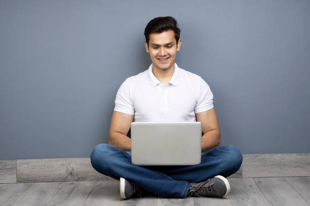 istock Handsome man using laptop, stock photo 1408224719