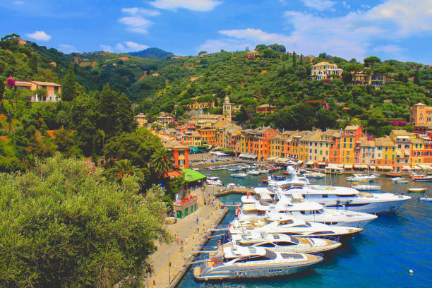 Italy portofino beach, boats and colorful houses.