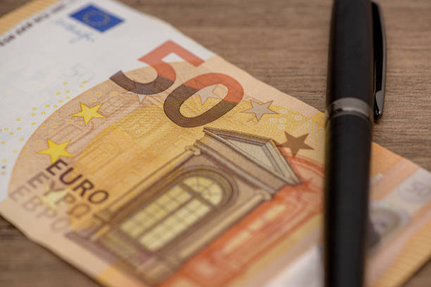Euro banknot standing on wooden table