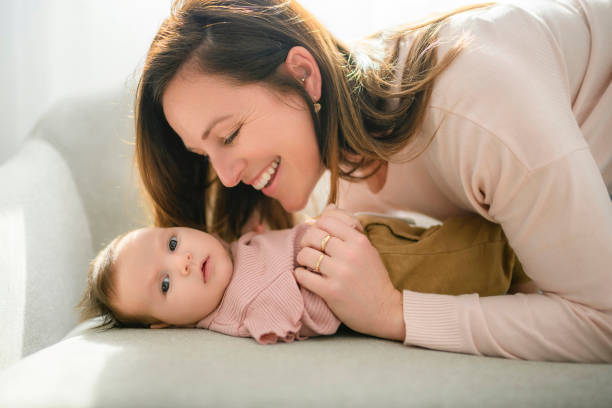 istock Mother with her baby son on sofa 1408227203