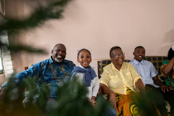 istock Happy extended family looking at Christmas tree 1408227208
