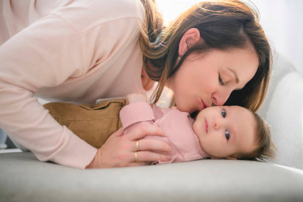 istock Mother with her baby son on sofa 1408227217